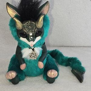 Teal Plush Fantasy Creature with Gold Accents and Pendant